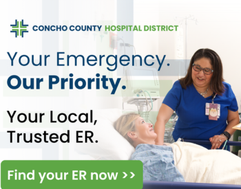 A nurse smiles while caring for a patient in a hospital bed at Concho County Hospital District. Text reads: "Your Emergency. Our Priority. Your Local, Trusted ER." with a green button below that says, "Find your ER now."