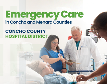 Physician and Nurses standing next to a female patients bedside. Emergency Care.